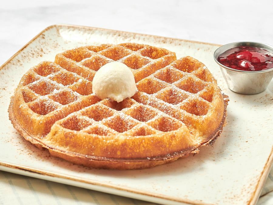 Our light and airy waffle with a side of warm mixed berry compote and powdered cinnamon sugar.
