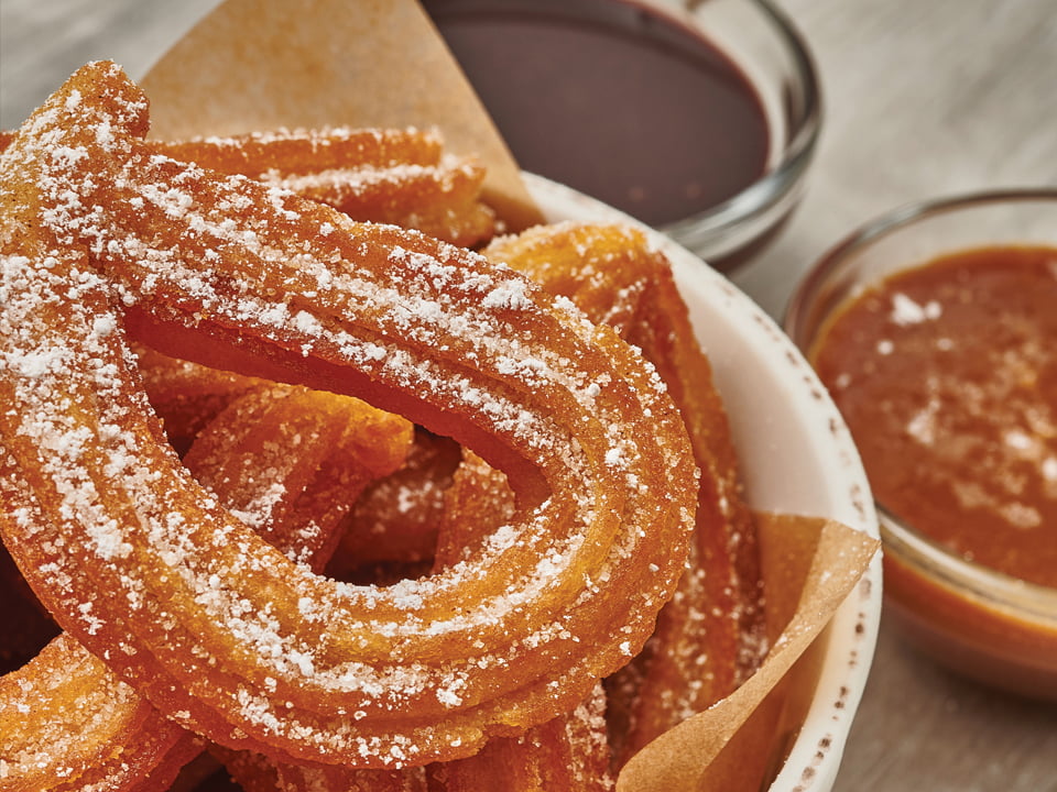 Cinnamon sugar-dusted churros served with sea salt caramel toffee and Mexican mocha dipping sauces.