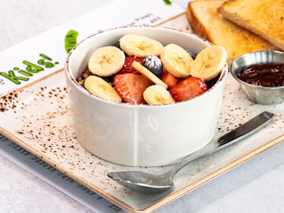 Non-fat vanilla Greek yogurt topped with our housemade granola with almonds, bananas, strawberries, blueberries and sprinkled with powdered cinnamon sugar. Served with sourdough toast.