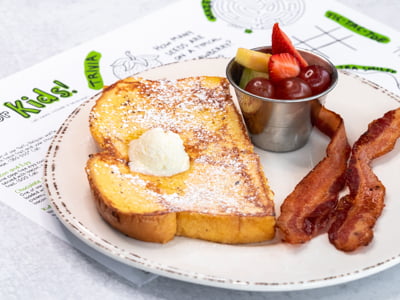 Made with our housemade batter. Served with fresh fruit and your choice of bacon or sausage.