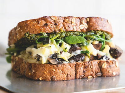 House-roasted Crimini mushrooms, zucchini and spinach with basil pesto, mayo and Mozzarella on our grilled artisan whole grain.