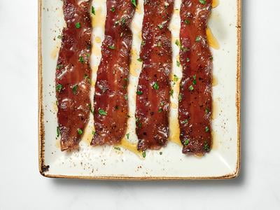 Four slices of our signature hardwood smoked bacon glazed with brown sugar, black pepper, cayenne and a maple syrup drizzle.