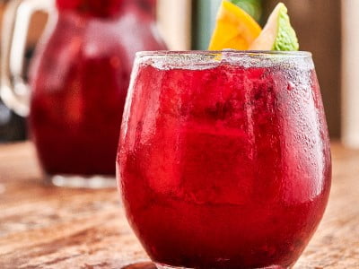 A signature blend of Merlot, mixed berries and apple with a squeeze of orange and lime. Each pitcher pours 2-3 servings. Great for sharing!