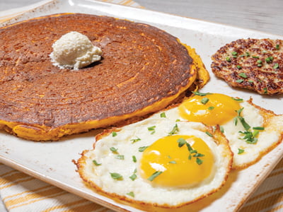 Two cage-free eggs cooked any style plus one of our signature spiced Pumpkin Pancakes and a Jones Dairy Farm grilled all-natural savory chicken sausage patty.