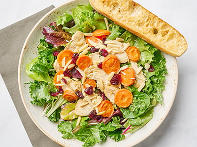 Vitamin-rich kale and organic mixed greens with housemade maple-roasted carrots, warm all-natural chicken breast, dried cranberries, slivered almonds and shredded Parmesan tossed in our refreshing maple-lemon vinaigrette.